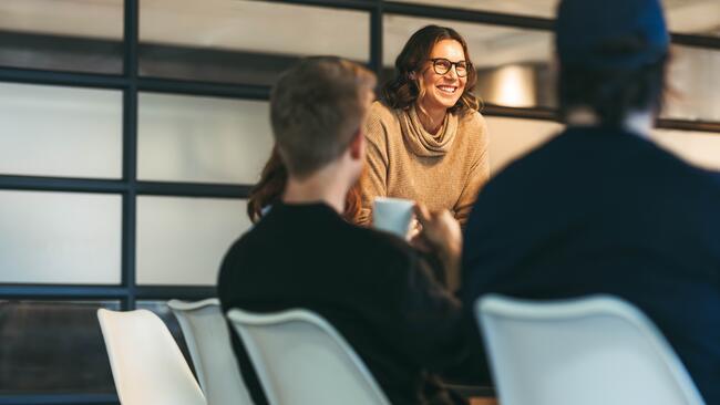 Casual woman leading meeting
