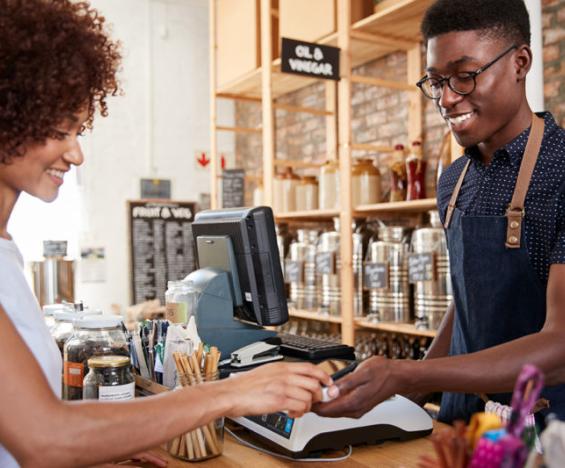 Women buying from small business owner